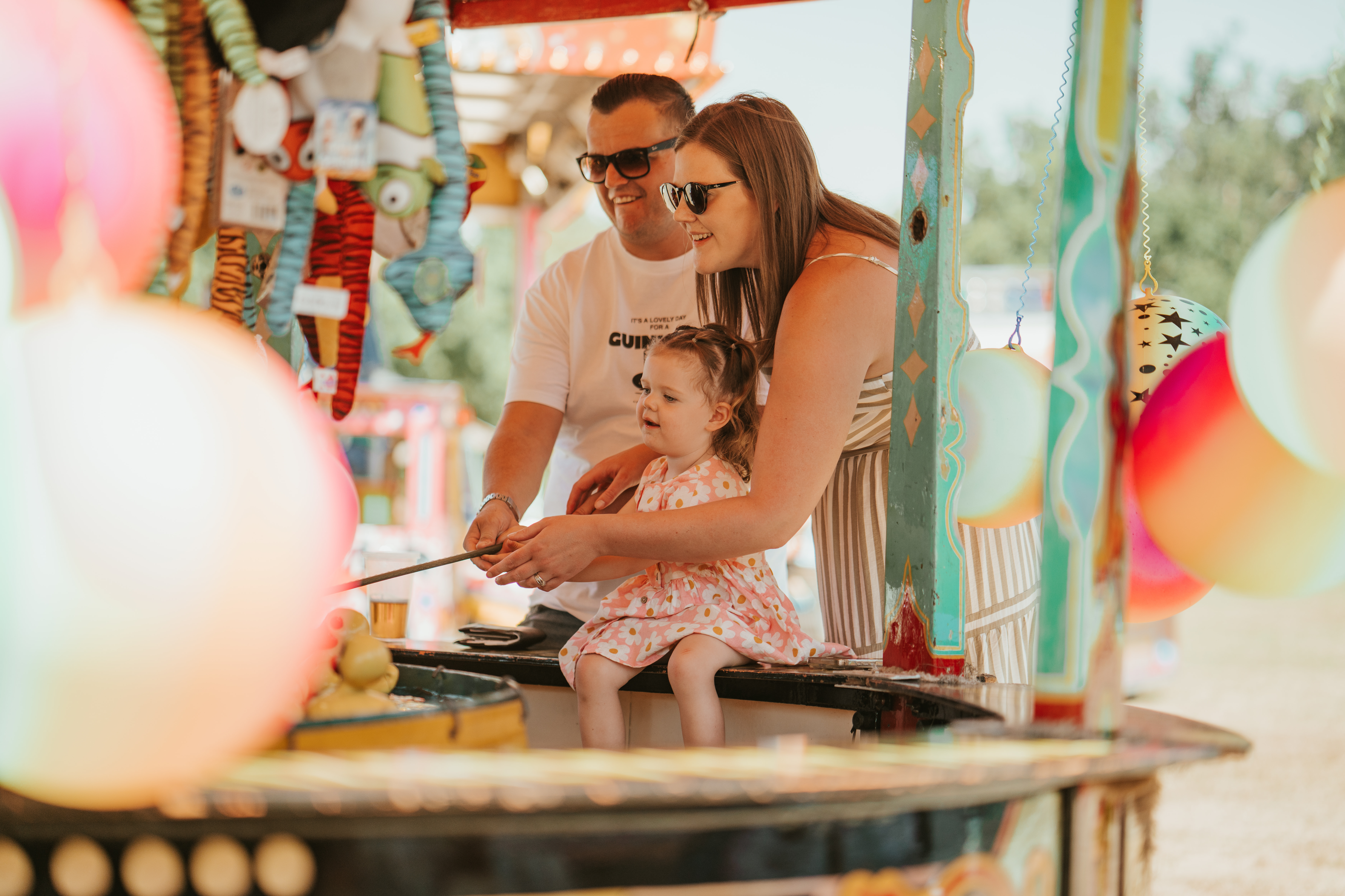Family Playing Hook A Duck At Summer Fete Open Weekend 2025.© The Shuttleworth Trust. Photo Mach 3 Studio